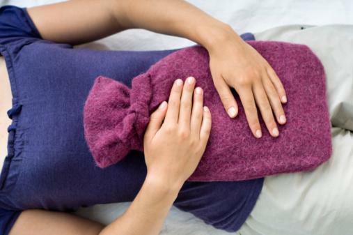 A hot-water bottle on the stomach is the easiest way to warm up the muscles of the uterus